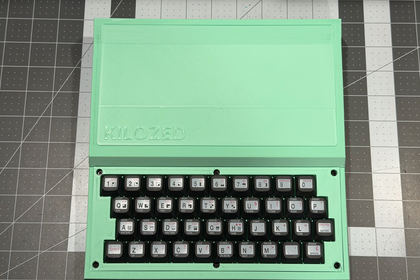 Assembled KILOZED prototype in mint green with logo embossed on the lid